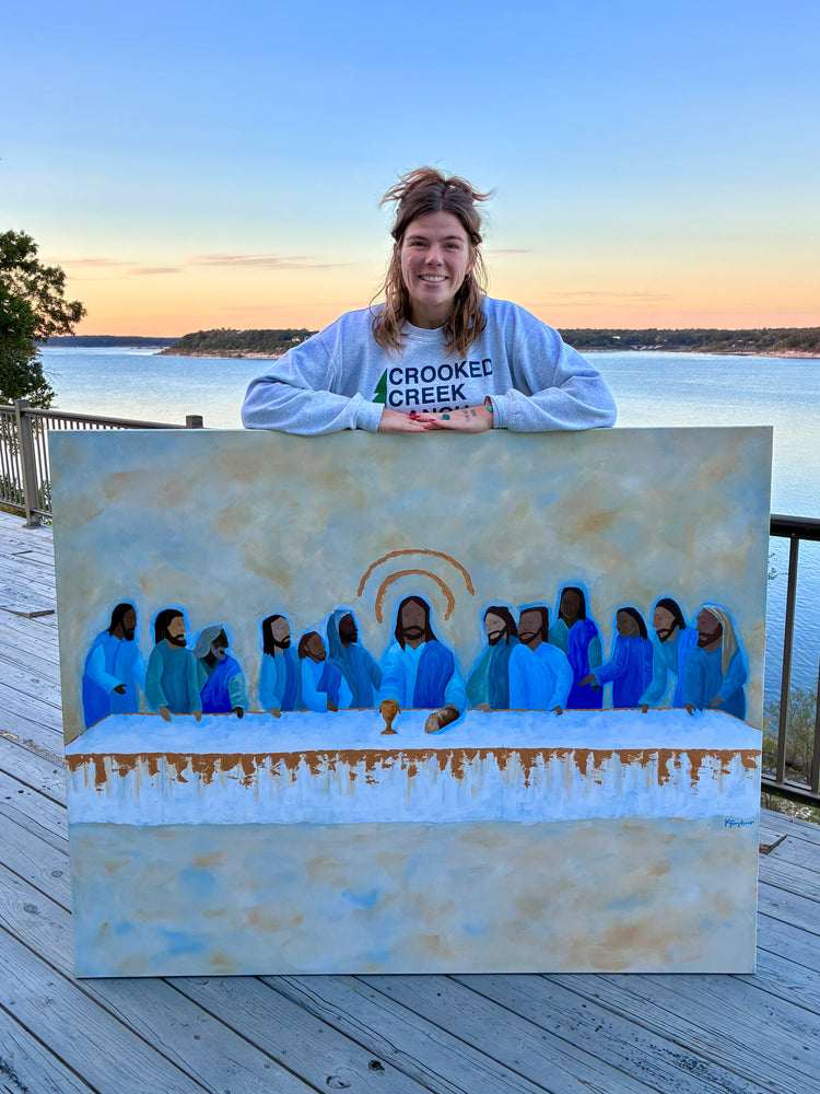 Kelsey Faykus with her Last Supper painting at sunset